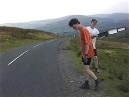 Oliver and John have fun with road markers at Sowry Head, Cliff Gate Road, 21.3 miles into the ride